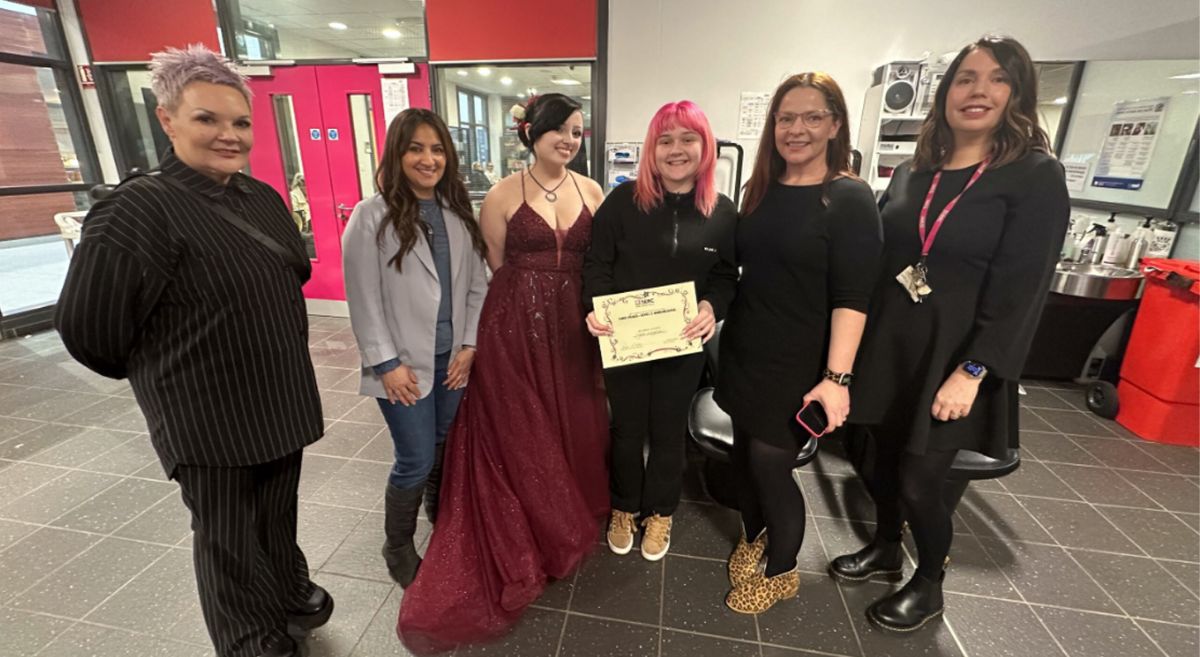 Picture of Hairdressing competition winner with model and judges